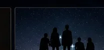 People looking at a star-filled sky as gift inspiration