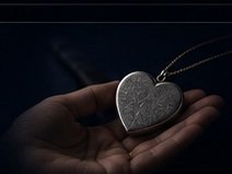 A meaningful heart keepsake held in a hand